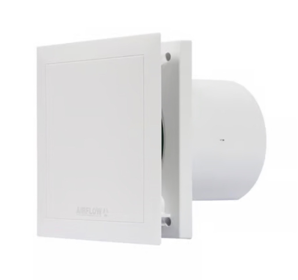 Wall-mounted extractor fan with ventilation grille installed in a bathroom